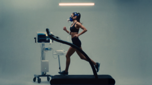 CGM vs metabolic testing: woman completing a PNOĒ metabolic breath test on a treadmill